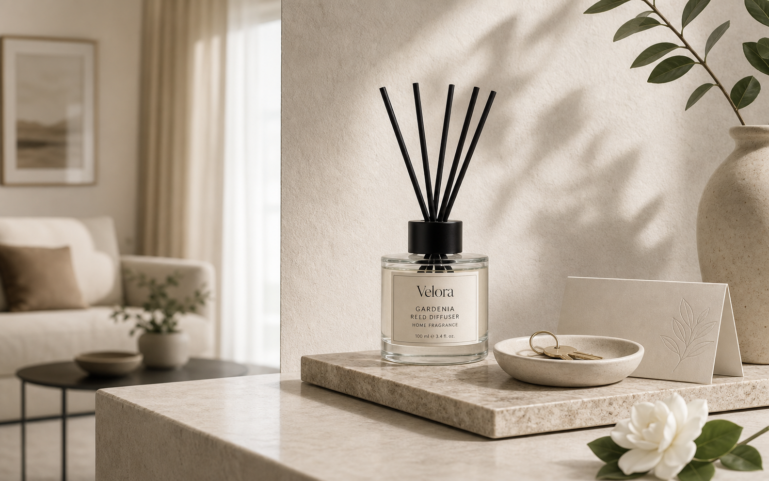 Velora Gardenia reed diffuser on a minimalist apartment entry console